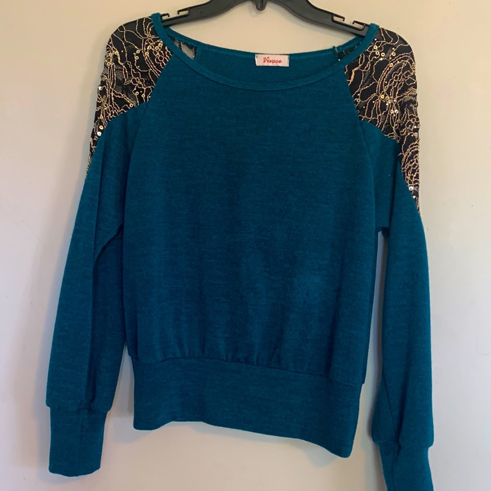 Green blouse with sequence around shoulder